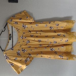 Women's mustard flower pattern shirt.
